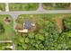 Bird's-eye view of a charming house nestled among lush trees, showcasing its serene and private setting at 7245 Static Way, Sherrills Ford, NC 28673