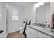 Well-lit bathroom with a granite countertop, a framed mirror, a toilet, and a glass enclosed shower at 7245 Static Way, Sherrills Ford, NC 28673