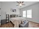 Cozy bedroom featuring a large bed, natural lighting, art pieces, and hardwood floors at 7245 Static Way, Sherrills Ford, NC 28673