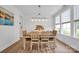 Bright dining room features a large window, a modern chandelier, and an elegant dining table at 7245 Static Way, Sherrills Ford, NC 28673