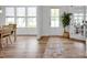 Bright foyer with hardwood floors, a stylish rug, and a view of the front door and living area at 7245 Static Way, Sherrills Ford, NC 28673