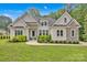 Charming single Gathering home with stone and stucco exterior and well-manicured front lawn at 7245 Static Way, Sherrills Ford, NC 28673