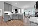 Modern kitchen with gray cabinets, stainless steel appliances, and hardwood floors at 7245 Static Way, Sherrills Ford, NC 28673