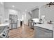 Modern kitchen with white cabinets, stainless steel appliances, and hardwood floors at 7245 Static Way, Sherrills Ford, NC 28673