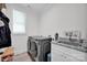 Laundry room featuring a washing machine, a sink with granite counter top, and a window at 7245 Static Way, Sherrills Ford, NC 28673