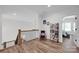 Cozy loft with a reading nook, a ceiling fan, a bookshelf, and hardwood floors at 7245 Static Way, Sherrills Ford, NC 28673