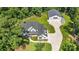 Aerial view of a home with detached garage and expansive lawn at 5811 Kristi Ln, Midland, NC 28107