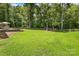 Spacious backyard with grassy lawn and wooden fence at 5811 Kristi Ln, Midland, NC 28107