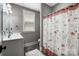 Bathroom with shower/tub combo, updated vanity, and decorative shower curtain at 5811 Kristi Ln, Midland, NC 28107