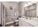 Bathroom with shower/tub combo, vanity, and linen closet at 5811 Kristi Ln, Midland, NC 28107