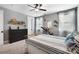 Bedroom with striped bedding, dresser, and exercise equipment at 5811 Kristi Ln, Midland, NC 28107