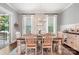 Elegant dining room with farmhouse table, chandelier, and access to deck at 5811 Kristi Ln, Midland, NC 28107