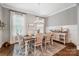 Bright dining room with farmhouse table and neutral decor at 5811 Kristi Ln, Midland, NC 28107