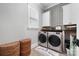 Laundry room with washer, dryer, and stylish storage at 5811 Kristi Ln, Midland, NC 28107