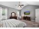 Spacious main bedroom with vaulted ceiling, striped bedding and ample natural light at 5811 Kristi Ln, Midland, NC 28107