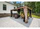 Relaxing patio area with gazebo, seating, and outdoor fire pit at 5811 Kristi Ln, Midland, NC 28107