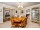 Formal dining room featuring a chandelier, wood table with six chairs, and carpeted floors at 9372 Island Point Rd, Sherrills Ford, NC 28673