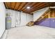 Spacious basement featuring water heater and staircase, waiting to be transformed into your dream space at 115 E Georgia Ave, Bessemer City, NC 28016