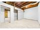 Partially framed basement with exposed beams, offering a blank canvas for your creative vision at 115 E Georgia Ave, Bessemer City, NC 28016