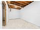 Unfinished basement with concrete floor and exposed ceiling beams, ready for customization at 115 E Georgia Ave, Bessemer City, NC 28016