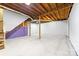Unfinished basement with open layout, stairs, and partial framing, ideal for customization at 115 E Georgia Ave, Bessemer City, NC 28016