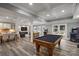 Game room with pool table and plenty of space for entertainment at 8516 Mcilwaine Rd, Huntersville, NC 28078
