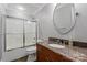 Updated bathroom with granite countertop and a shower/tub combo at 8516 Mcilwaine Rd, Huntersville, NC 28078