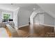 Spacious bedroom with hardwood floors and a large window at 8516 Mcilwaine Rd, Huntersville, NC 28078