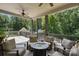 Spacious deck with multiple seating areas and wooded views at 8516 Mcilwaine Rd, Huntersville, NC 28078