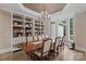 Formal dining room with a large table and built-in shelving at 8516 Mcilwaine Rd, Huntersville, NC 28078