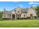 Elegant brick home with a manicured lawn at 8516 Mcilwaine Rd, Huntersville, NC 28078