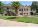 Brick home with a pool, expansive deck, and lush landscaping at 8516 Mcilwaine Rd, Huntersville, NC 28078