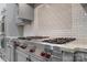 Luxury kitchen features a Wolf range and custom cabinetry at 8516 Mcilwaine Rd, Huntersville, NC 28078