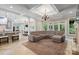 Open living room with sectional sofa and kitchen view at 8516 Mcilwaine Rd, Huntersville, NC 28078