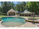Inviting pool and spa area, surrounded by lush landscaping at 8516 Mcilwaine Rd, Huntersville, NC 28078