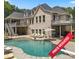 Luxury home with a beautiful pool, expansive patio, and large backyard at 8516 Mcilwaine Rd, Huntersville, NC 28078