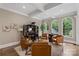 Relaxing sitting area with leather chairs and a built-in bar at 8516 Mcilwaine Rd, Huntersville, NC 28078