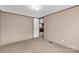 Simple bedroom with carpeted floor and door leading to kitchen at 850 Mereva Rd, Smyrna, SC 29743