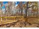 Wooden deck overlooking a wooded area with steps leading down at 850 Mereva Rd, Smyrna, SC 29743