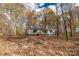 Gray house with black shutters, sits on a wooded lot at 850 Mereva Rd, Smyrna, SC 29743