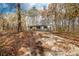 Gray house with black shutters and gravel driveway at 850 Mereva Rd, Smyrna, SC 29743