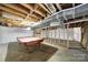 Unfinished basement with exposed ceiling featuring a pool table at 9143 Sadlers Ridge Rd, Fort Mill, SC 29707