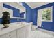 Bright bathroom with blue accent wall and black and white tile floors at 9143 Sadlers Ridge Rd, Fort Mill, SC 29707