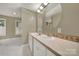 Bathroom features dual sinks with decorative mirrors and cabinets at 9143 Sadlers Ridge Rd, Fort Mill, SC 29707