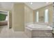 Bright bathroom with a relaxing soaking tub and tile floors at 9143 Sadlers Ridge Rd, Fort Mill, SC 29707
