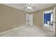 Bedroom with neutral carpet and view into the blue bathroom at 9143 Sadlers Ridge Rd, Fort Mill, SC 29707