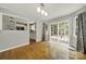 Open dining area featuring wood floors and a slider to the deck, adjacent to the eat-in kitchen at 9143 Sadlers Ridge Rd, Fort Mill, SC 29707