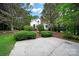 Charming home with a brick chimney, mature trees, and a spacious driveway at 9143 Sadlers Ridge Rd, Fort Mill, SC 29707