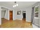 Entryway featuring a half bath, black front door with decorative glass and hardwood floors at 9143 Sadlers Ridge Rd, Fort Mill, SC 29707