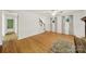 Open living room with hardwood floors, staircase, and natural light at 9143 Sadlers Ridge Rd, Fort Mill, SC 29707